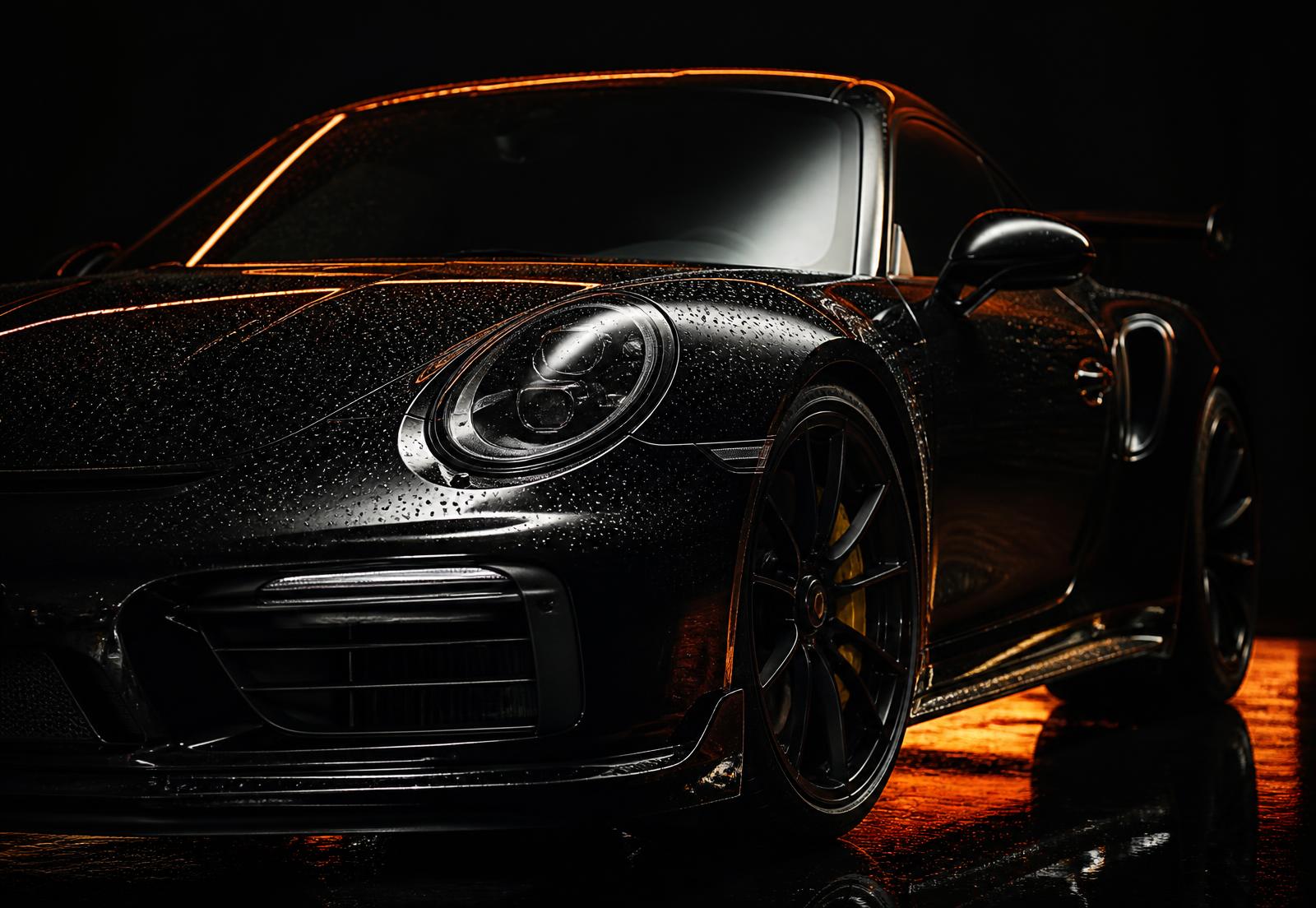 Carro esportivo preto com pintura impecável após detalhamento
